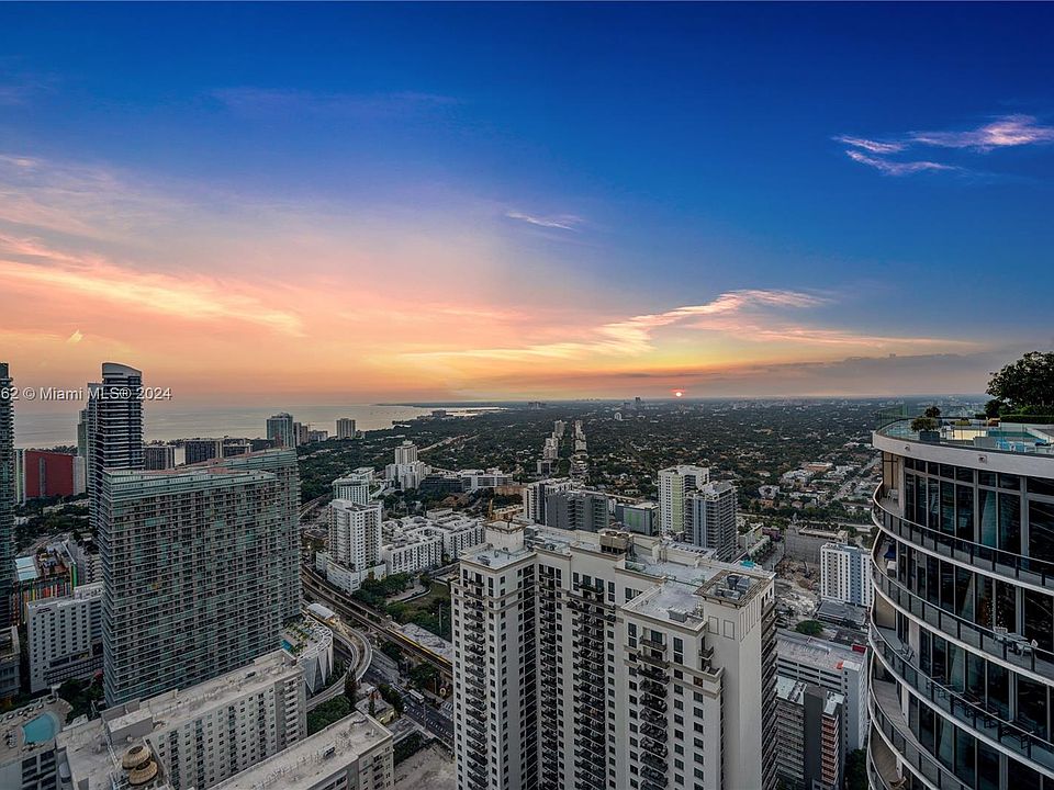 Luxury Brickell penthouse living room with floor-to-ceiling Miami skyline views